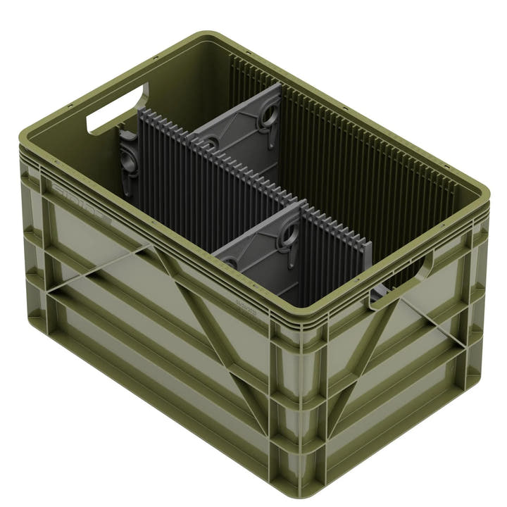 Green SidioCrate storage bin with black internal dividers for organized camper van storage.