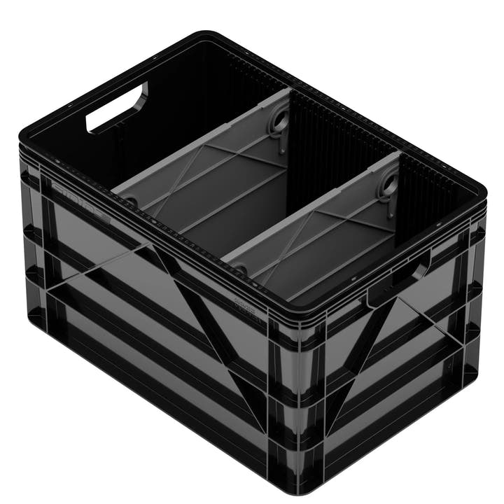 Black plastic SidioCrate full size storage bin with interior dividers for camper van organization.