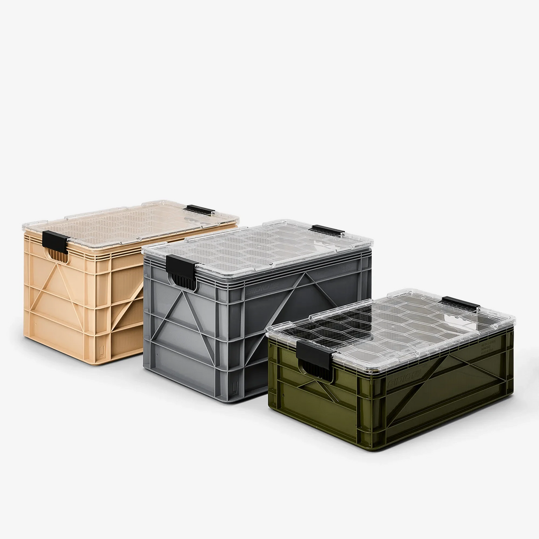 Three SidioCrate full size storage bins with clear lids in tan, grey, and olive green.